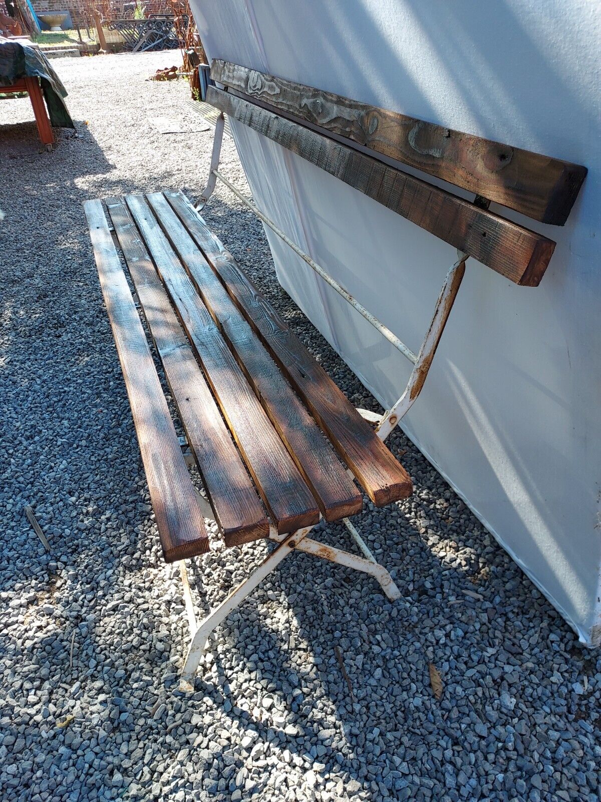 Folding garden bench in wrought iron and wood