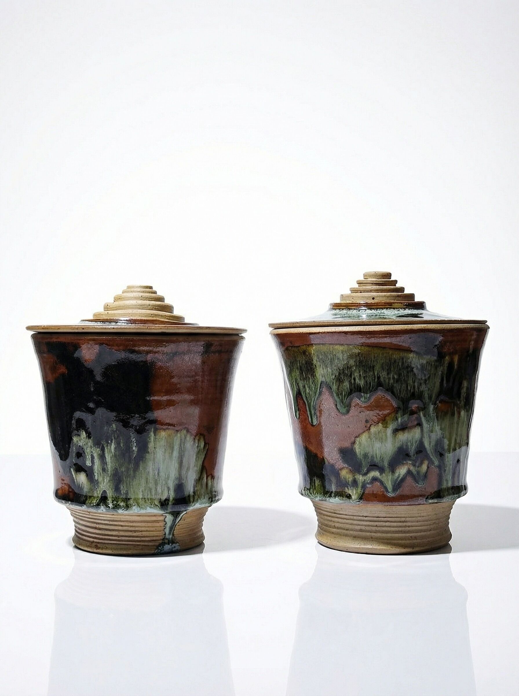 A pair of vintage stoneware pots from the 80s-90s with a Japanese style, signed handmade pottery.