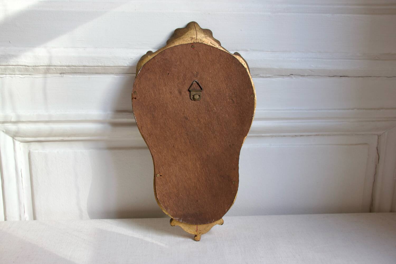 Small golden mirror in baroque style