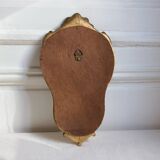 Small golden mirror in baroque style