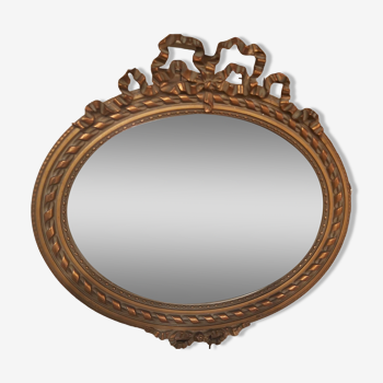 Miroir biseauté ovale doré style Louis XVI