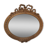 Miroir biseauté ovale doré style Louis XVI
