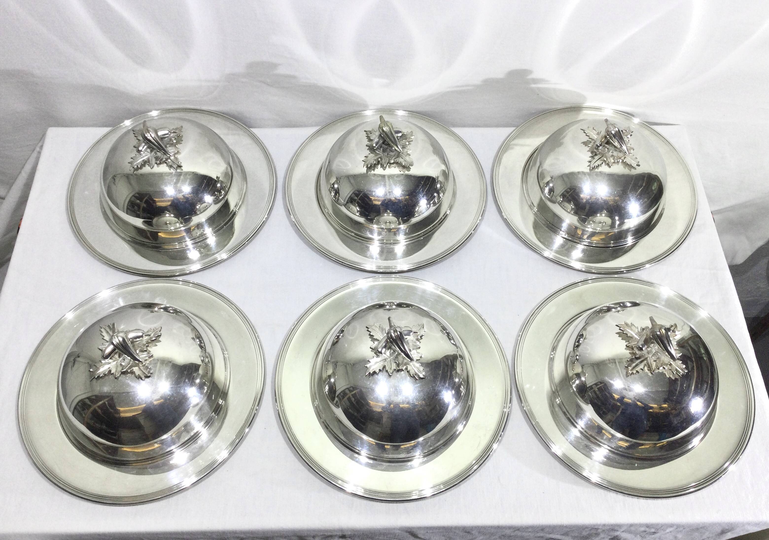 Set of silver-plated serving dishes and bells