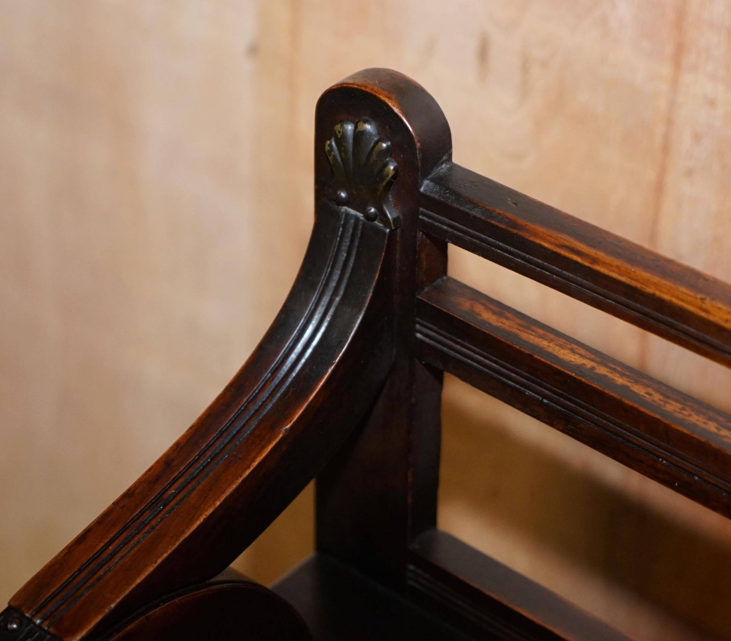 Antique entrance bench by Jas Shoolbred with brass fittings and walnut frame circa 1890.