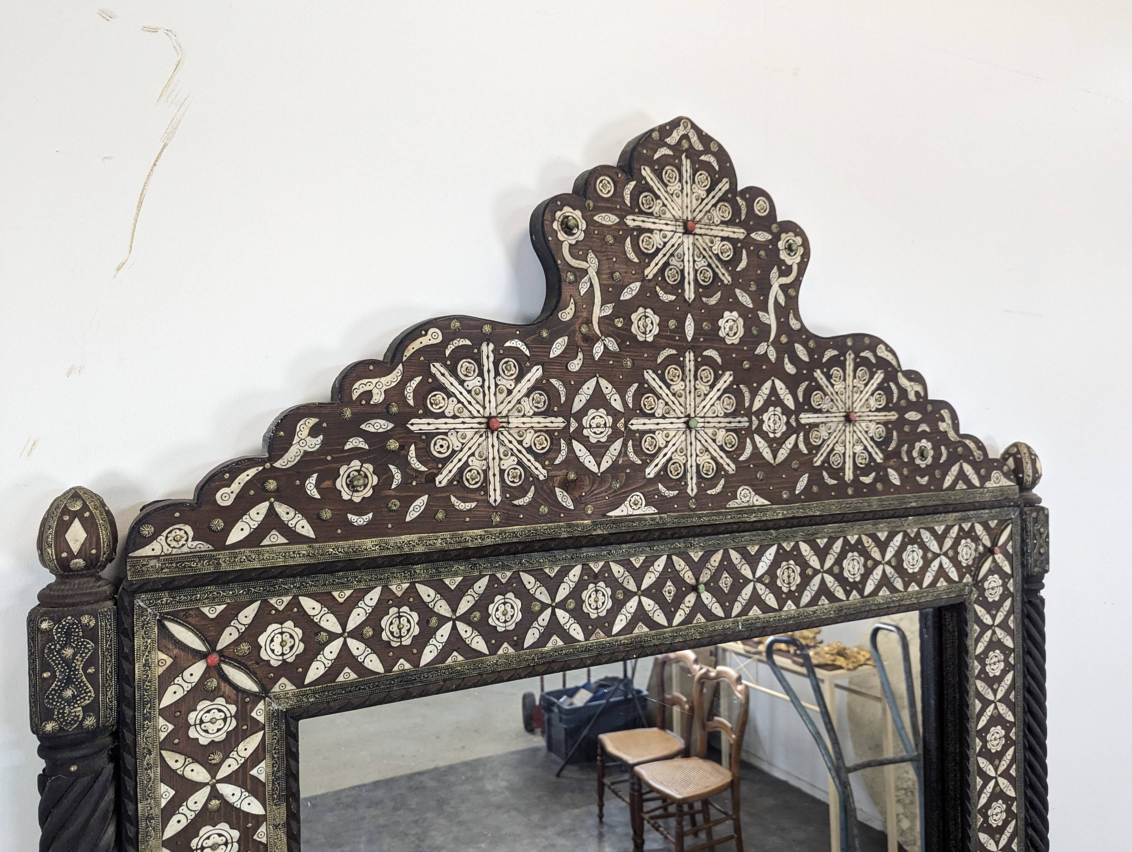 Orientalist mirror with bone inlays and hard stone cabochons.