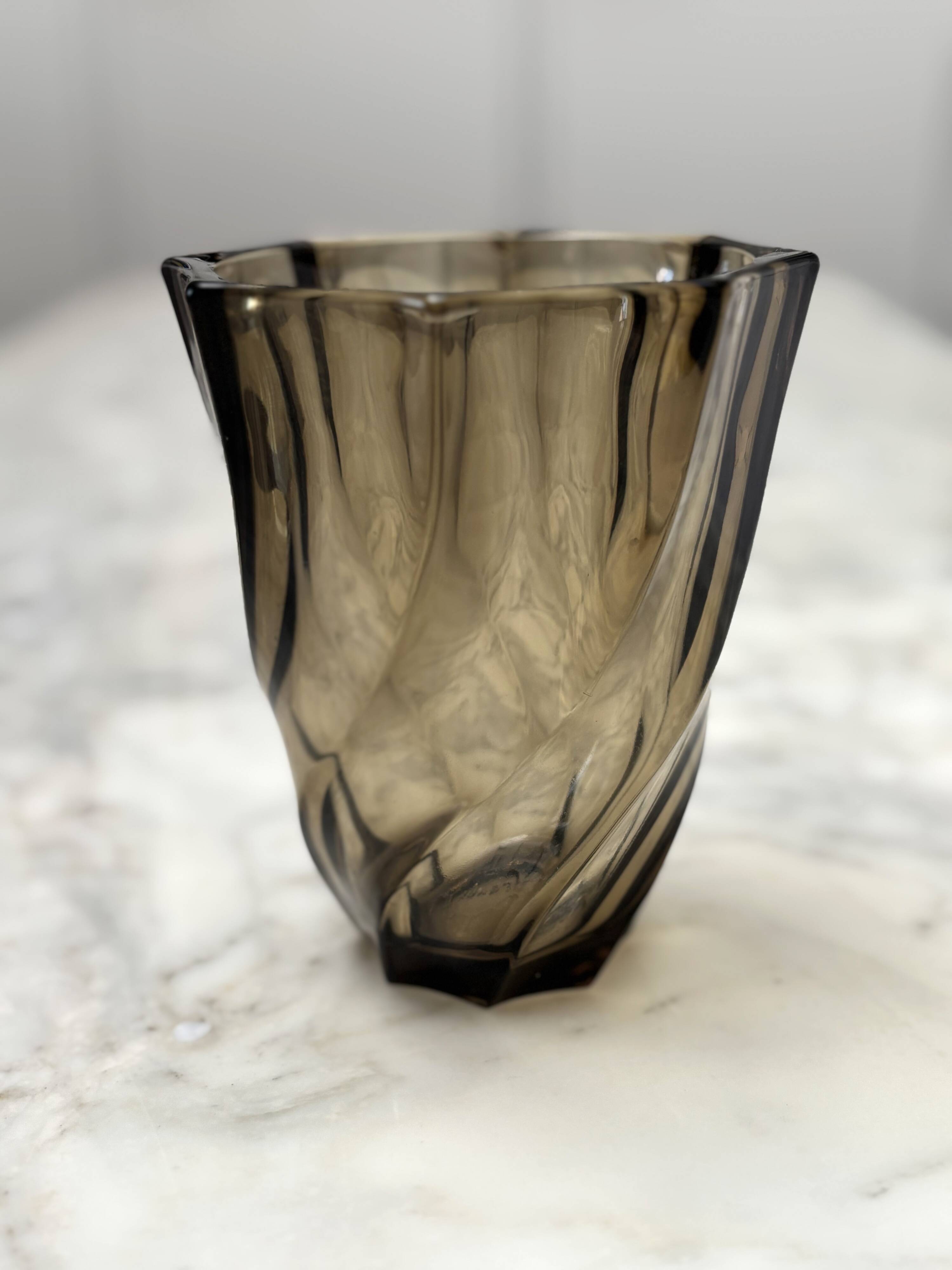 Small translucent dark brown twisted glass vase