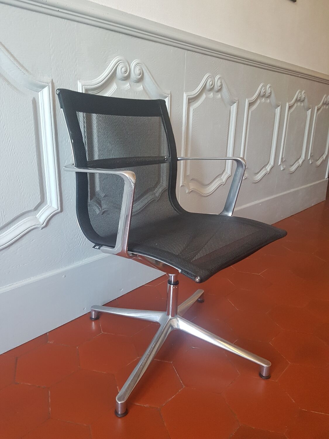 Una Chair armchair in black mesh published by ICF