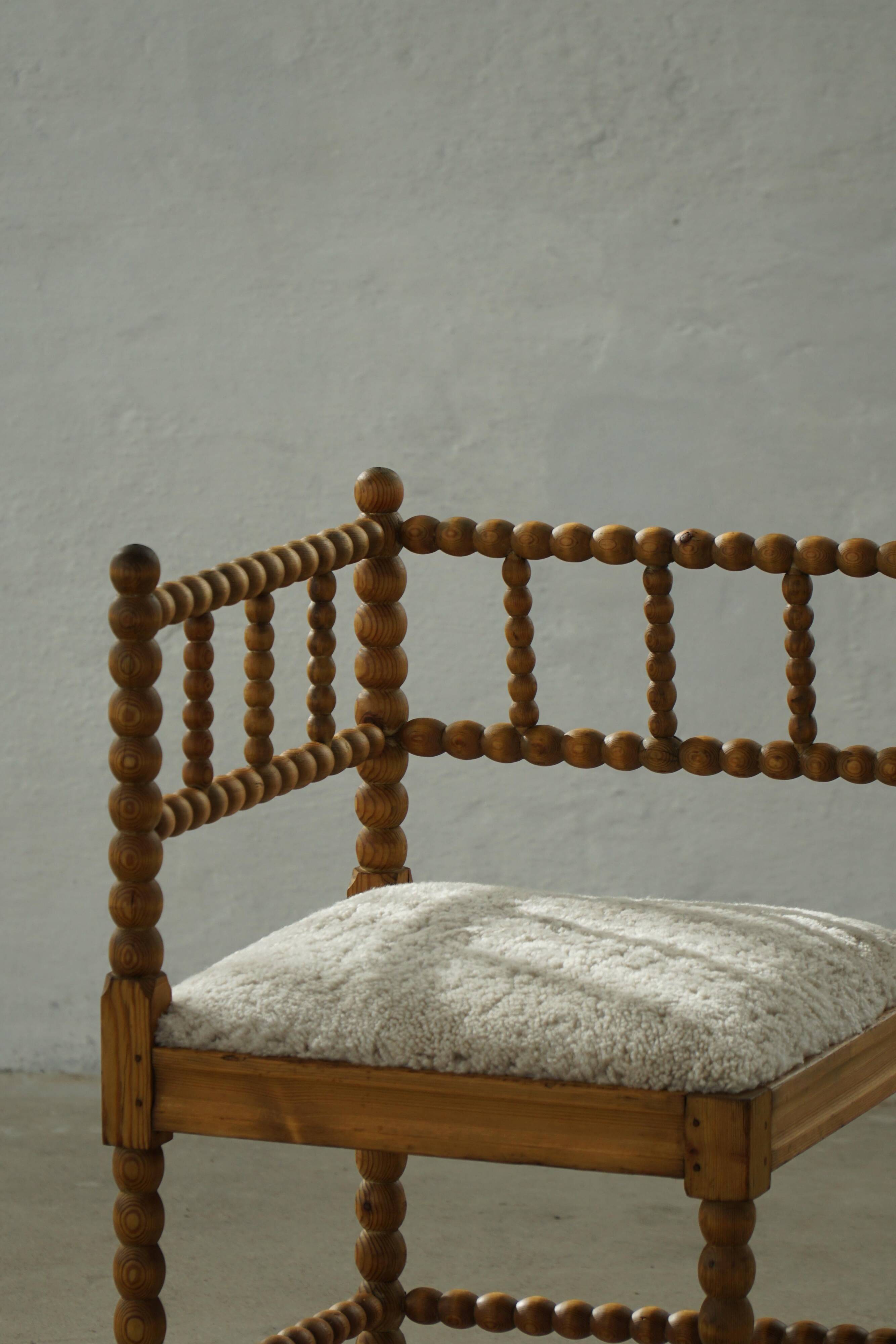 Antique French corner chair handcrafted with lamb's wool, early 20th century.