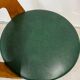 Vintage Baumann chair from the 1950s - curved wood and green seat.