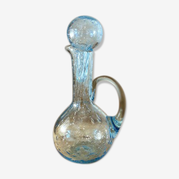 Small decanter made of blue bubbled blown glass