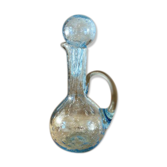 Small decanter made of blue bubbled blown glass