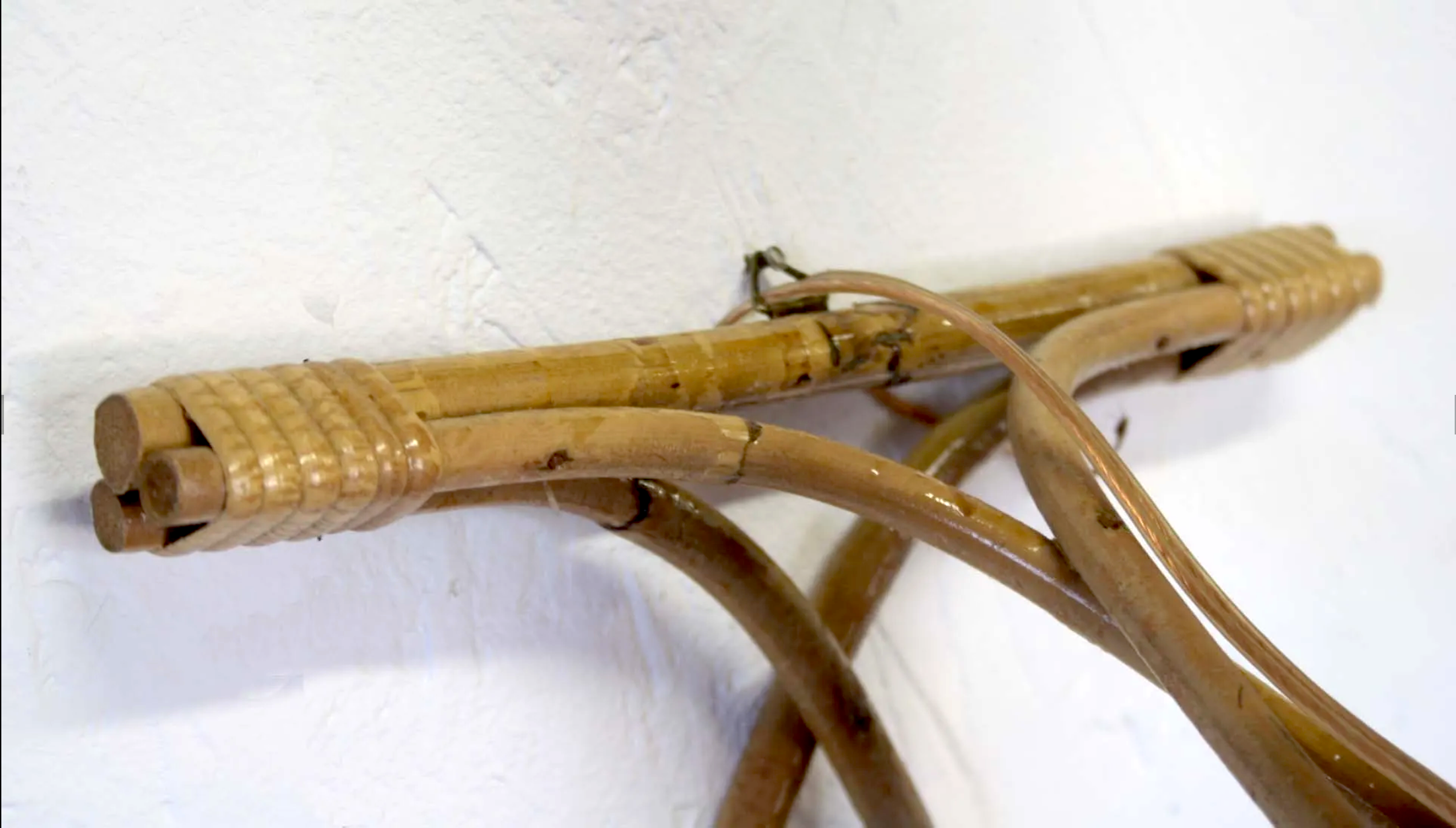 Pair of Louis Sognot rattan sconces