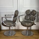 Pair of italian swivel armchairs in chrome-plated metal and piton imitation fabrics