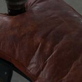 Dark red upholstered camel saddle stool, 20th century, North Africa.