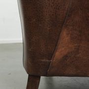 Vintage sheepskin armchair with a unique design and timeless appearance