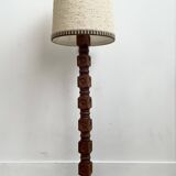 Brutalist floor lamp in turned wood, in the style of Charles Dudouyt.