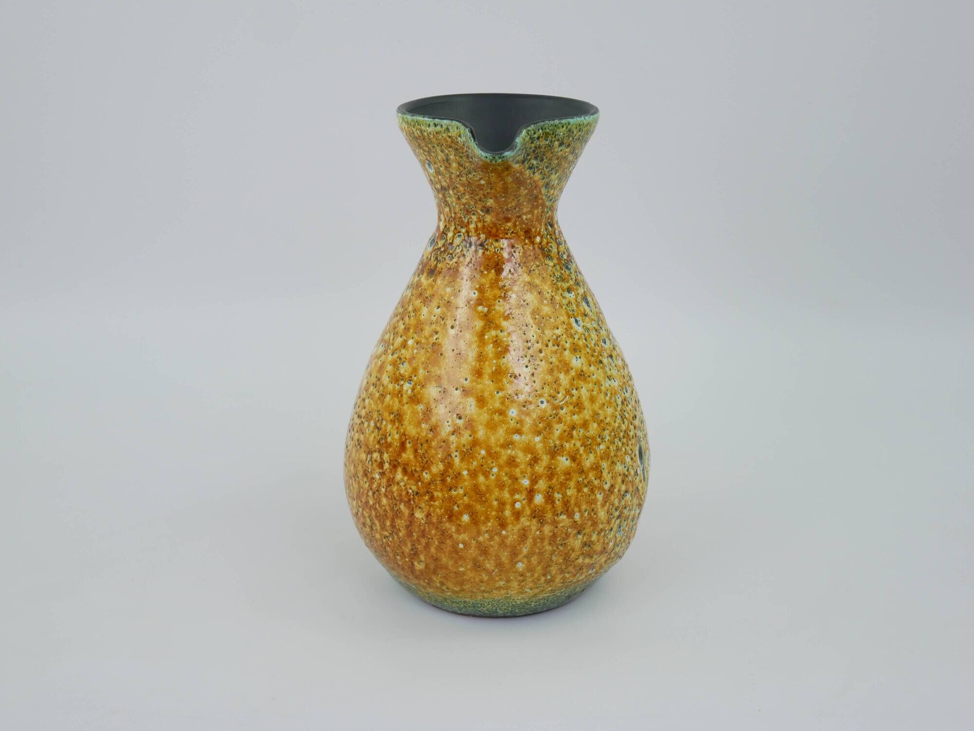 Large yellow ceramic pitcher in the Accolay style