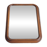 Vintage wooden framed mirror with bevelled glass.