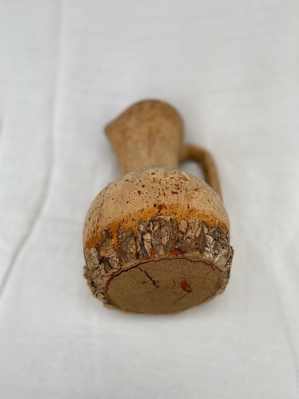 Terracotta jug covered with cork