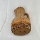 Terracotta jug covered with cork