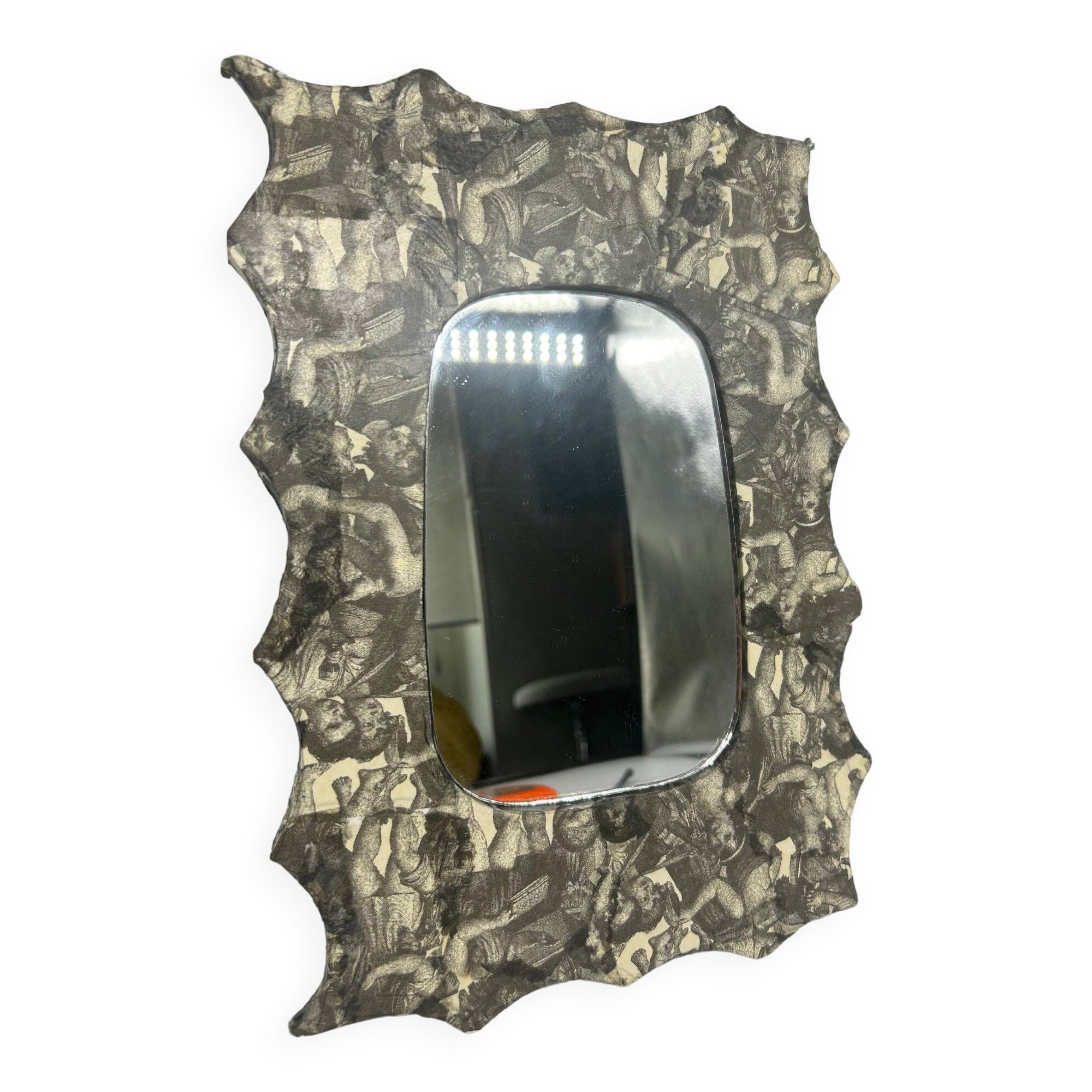 Free-form mirror decorated with cherubs