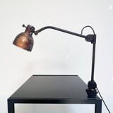 Industrial in height to be adjusted vintage clamp lamp from the 1970s