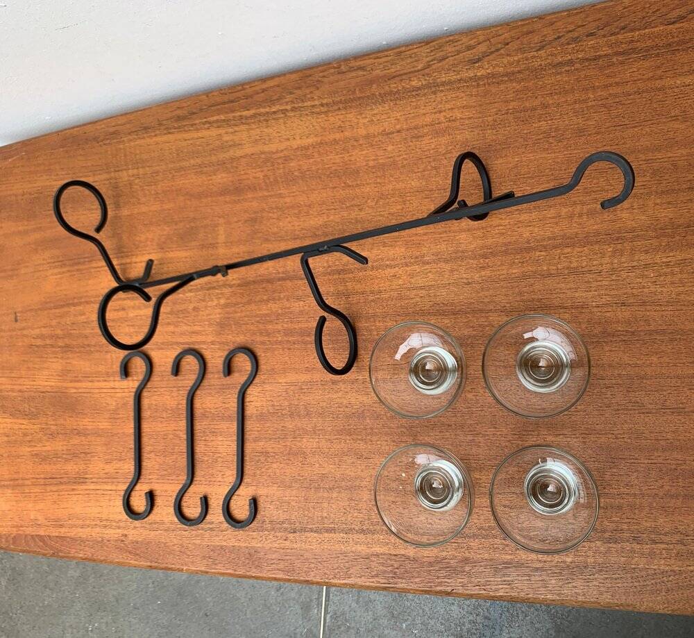 Mid-century metal and glass pendant light from the 1960s.