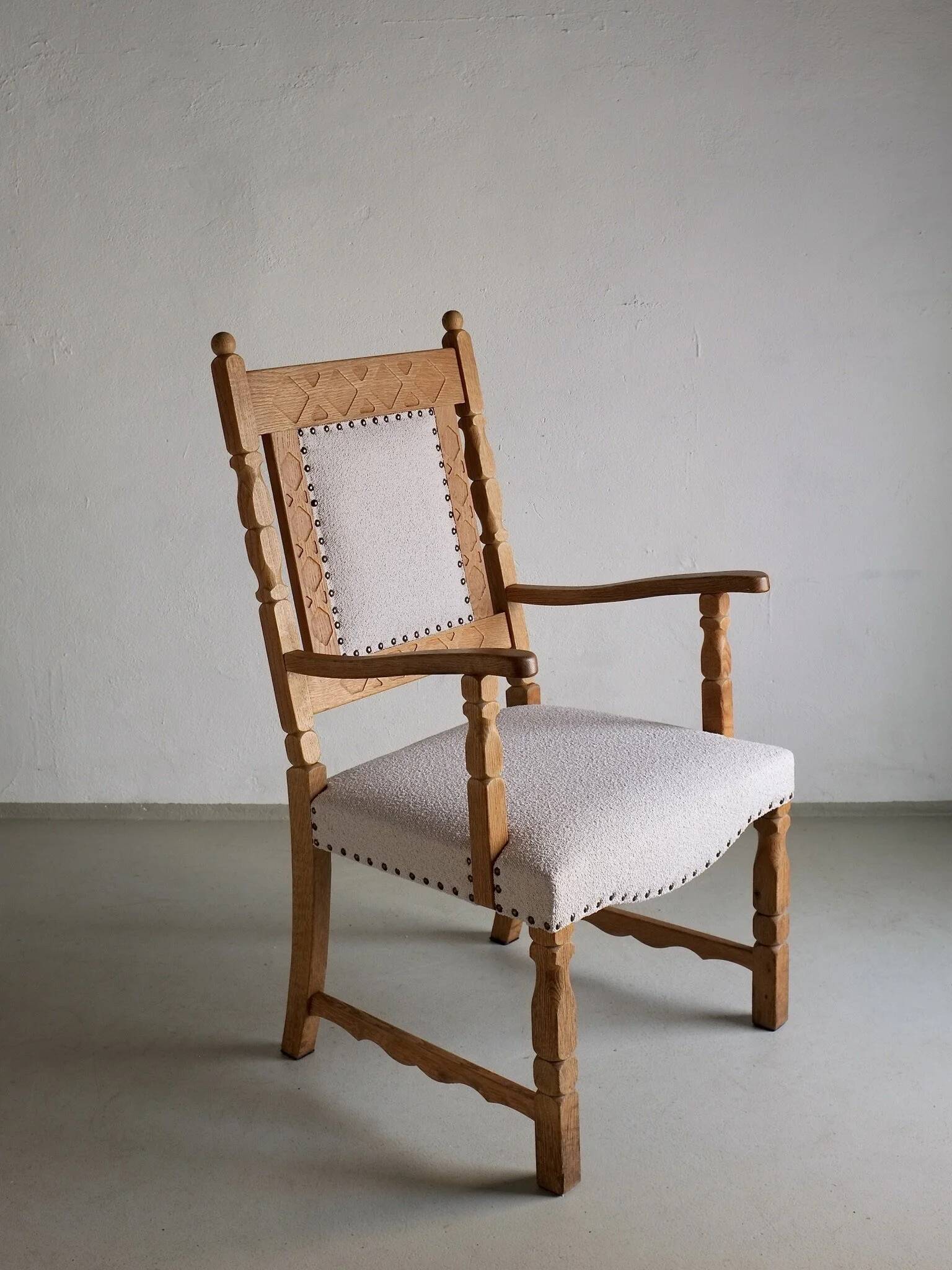 Carved oak armchair by Henning Kjaernulf | Denmark | 1960s