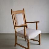 Carved oak armchair by Henning Kjaernulf | Denmark | 1960s