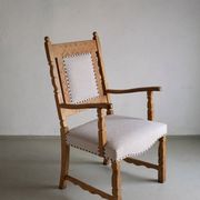 Carved oak armchair by Henning Kjaernulf | Denmark | 1960s