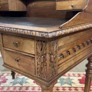 Louis XVI style desk from the late 19th century in walnut with a leather top.