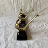Vintage coat rack in lacquered metal with three golden aluminum hooks