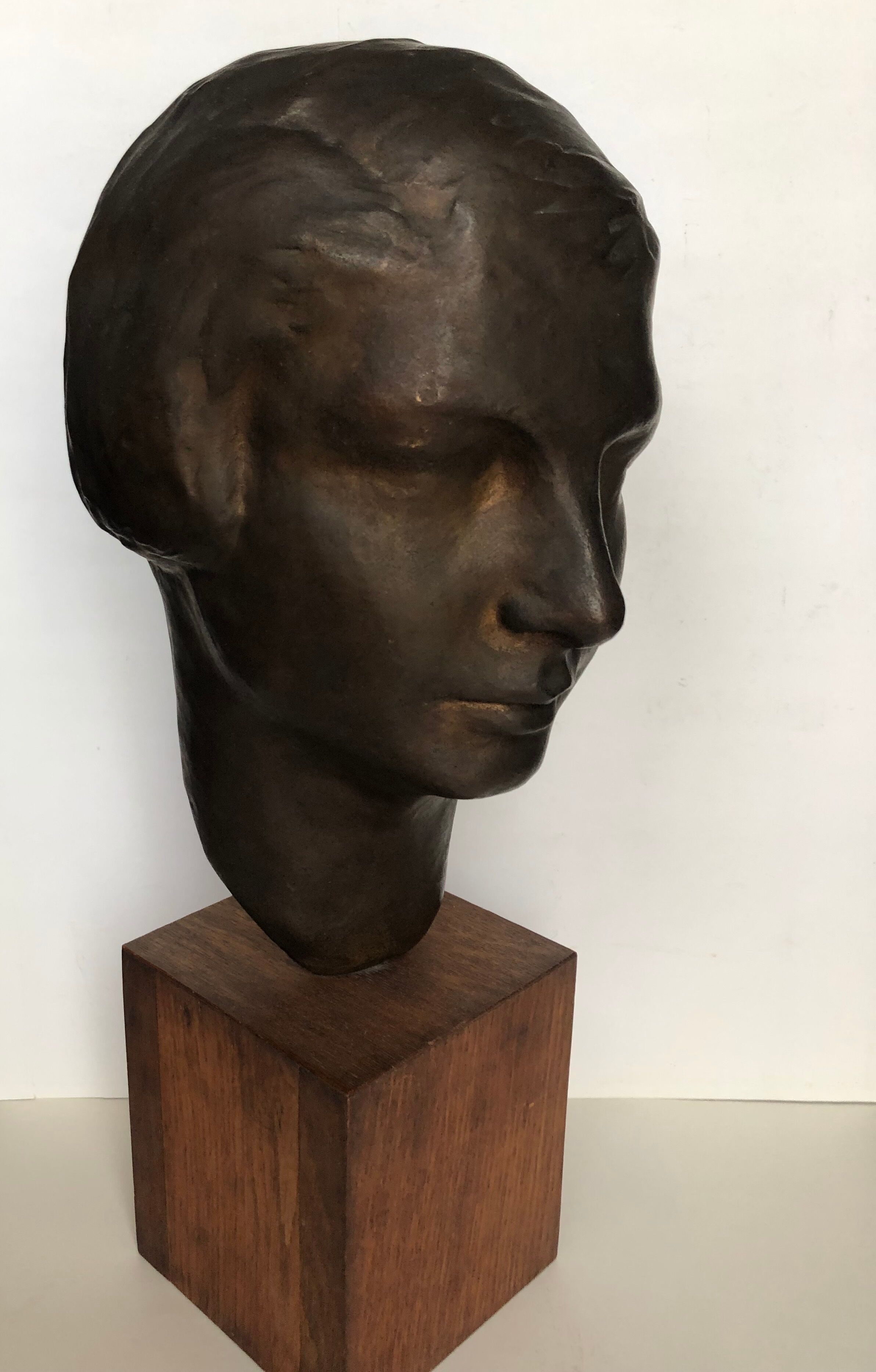 Bronze young woman's head