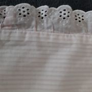Old baby bed linen adornment