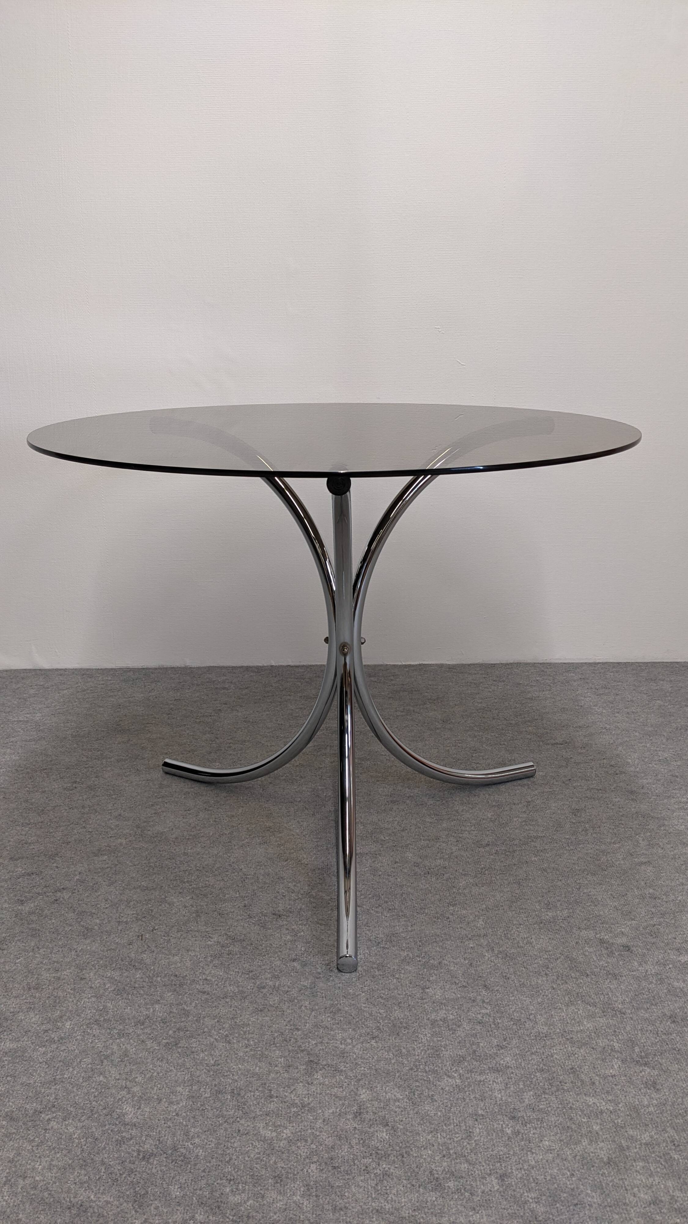 Chrome metal and smoked glass round table, Italy circa 1970.
