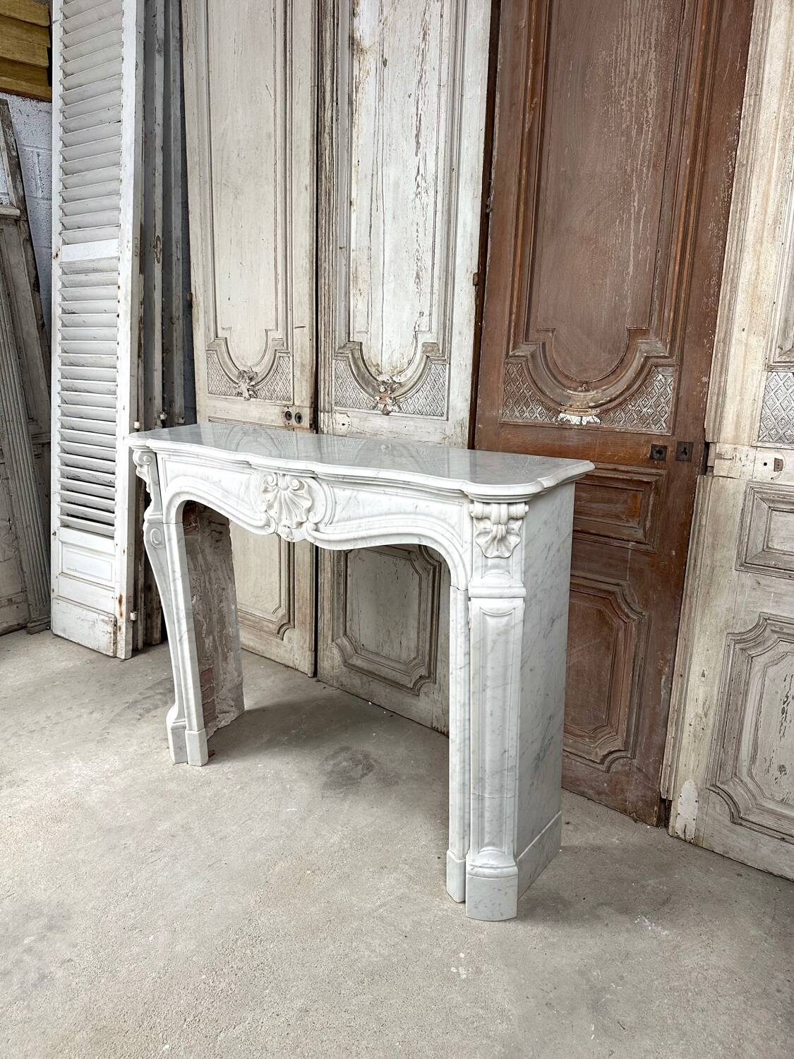 Louis XV style fireplace in white marble