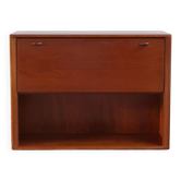 Vintage teak bar cabinet with black glass interior.