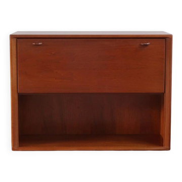 Vintage teak bar cabinet with black glass interior.