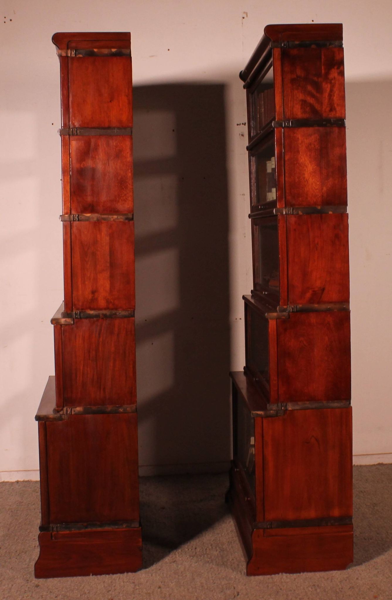 pair of Globe Wernicke London 'waterfall' bookcases in mahogany circa