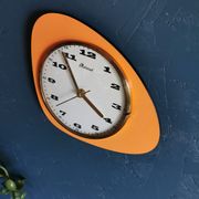 Vintage formica clock asymmetrical silent wall clock "Mervex orange"
