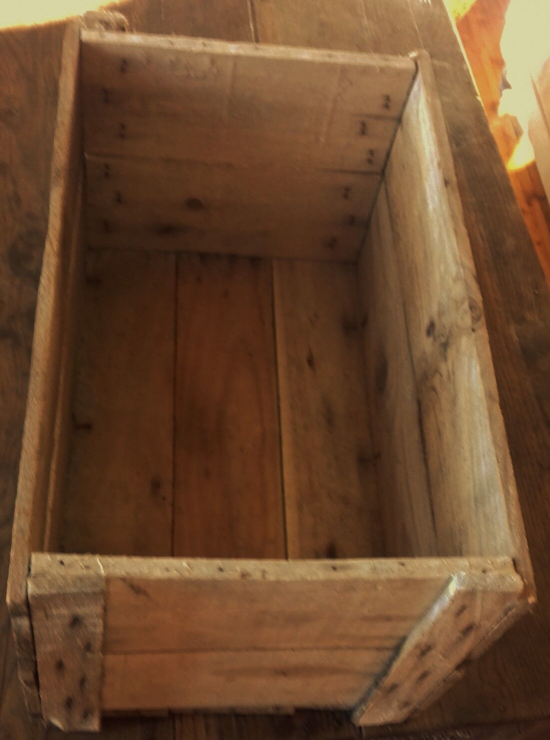 Wooden case with letters in black inck