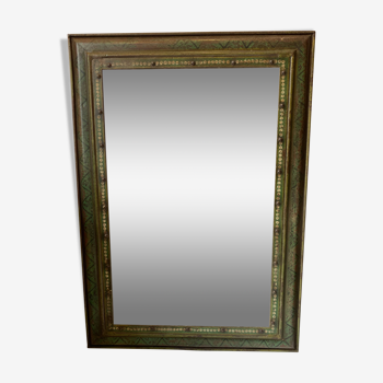 Mirror with polychrome metal frame