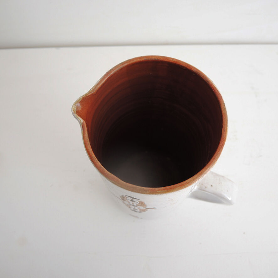 Old glazed terracotta carafe with signature
