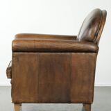 Armchair / lounge chair made of sheepskin leather with characterful patina