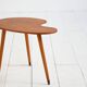 Biomorphic teak and brass side table from the 1950s–1960s