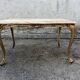 Gilded brass coffee table with onyx top