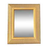Mirror with striated and gilded decor