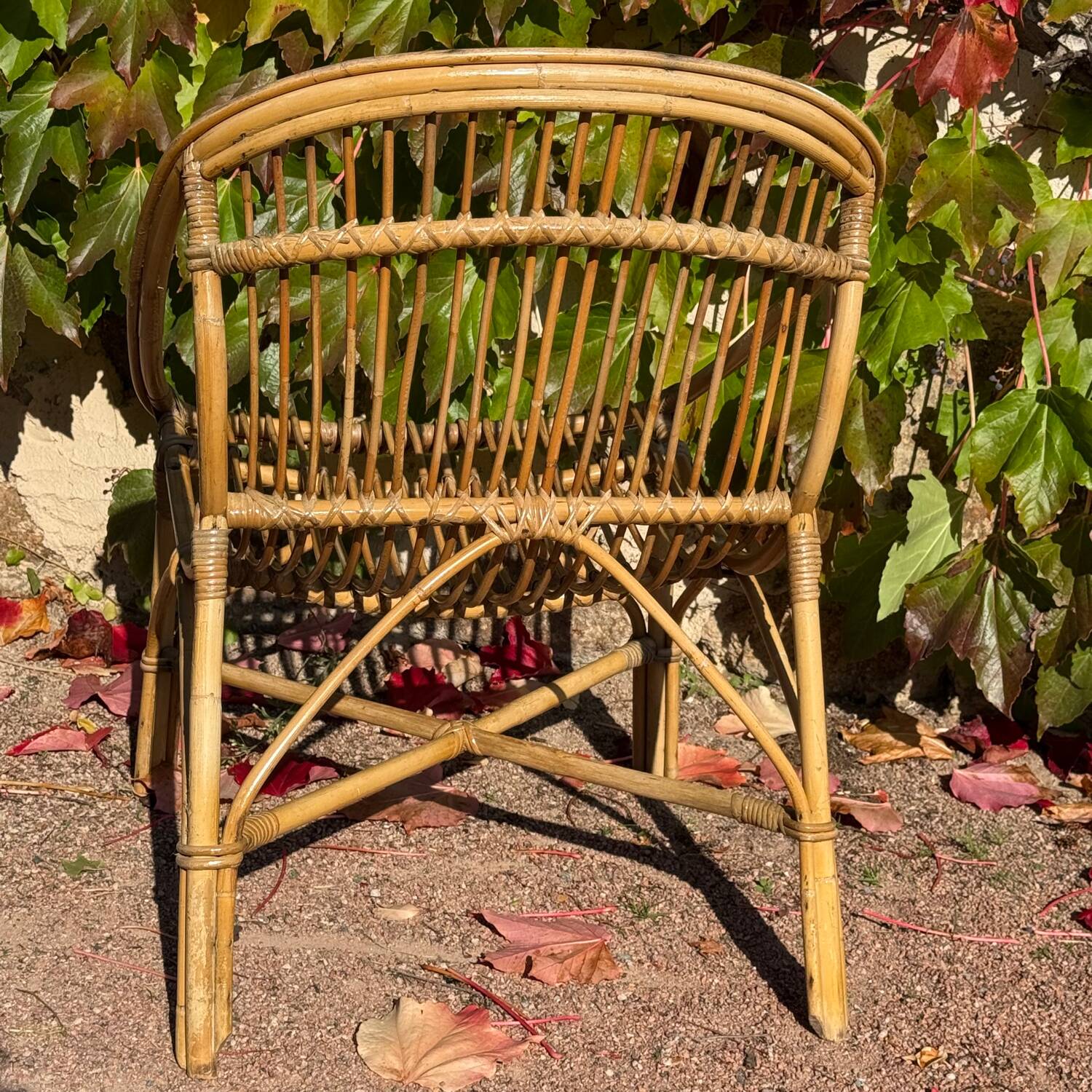 Pair of 1950s rattan armchairs from France.