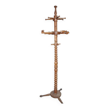 Brown turned beech coat stand, sculpted column, stable tripod.