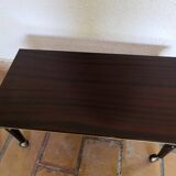 Lacquered coffee table with vintage wheels 70s